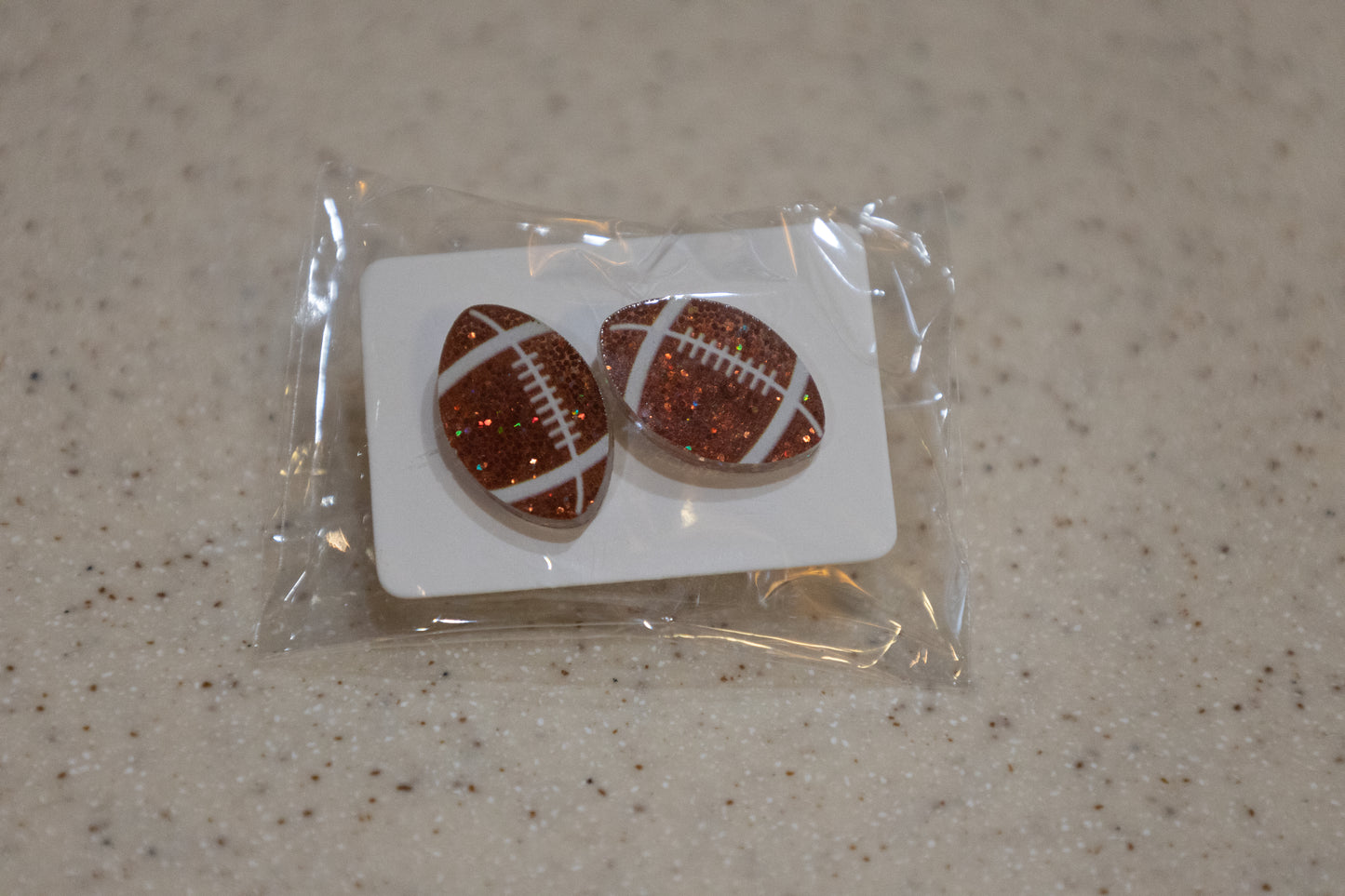 Football stud earrings
